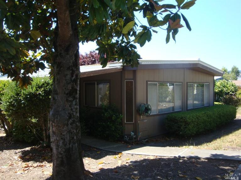 29 Springhill Court, Unit 29 Santa Rosa, CA 95409 - Photo 1 of 1 a front view of a house with a yard and garage
