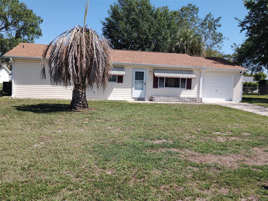 a view of a house with a yard