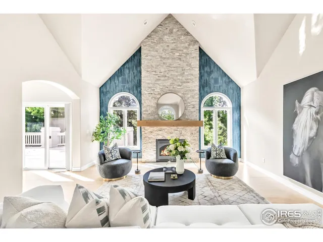 a living room with furniture potted plant and window