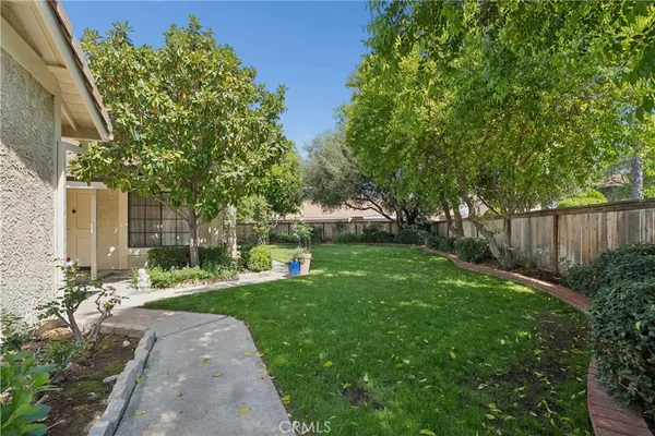 a backyard of a house with lots of green space