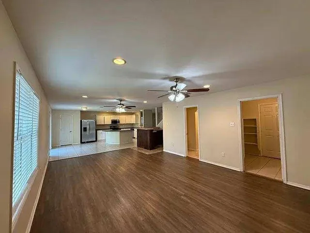 a view of a kitchen with a sink and a window