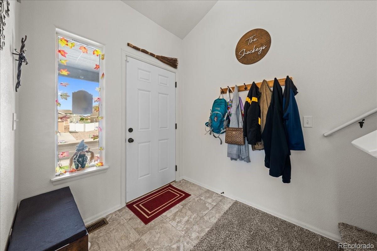 949 Ashbrook Drive Windsor, CO 80550 - Photo 13 of 33 a view of walk in closet with clothes and shoes