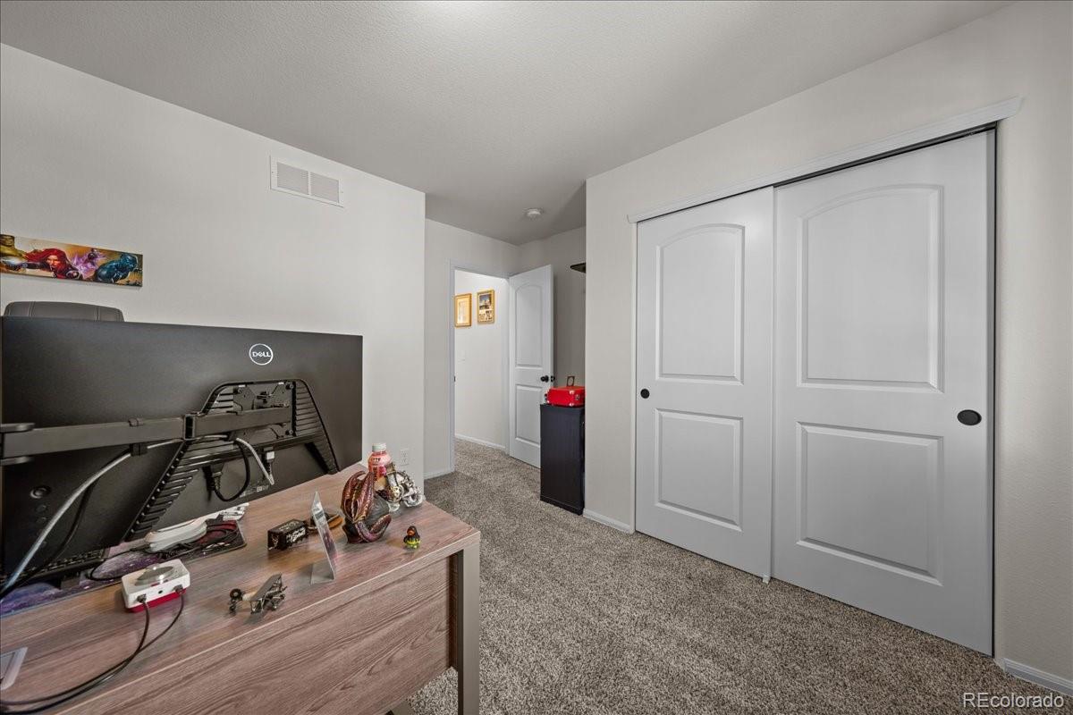949 Ashbrook Drive Windsor, CO 80550 - Photo 19 of 33 a room with storage and utility