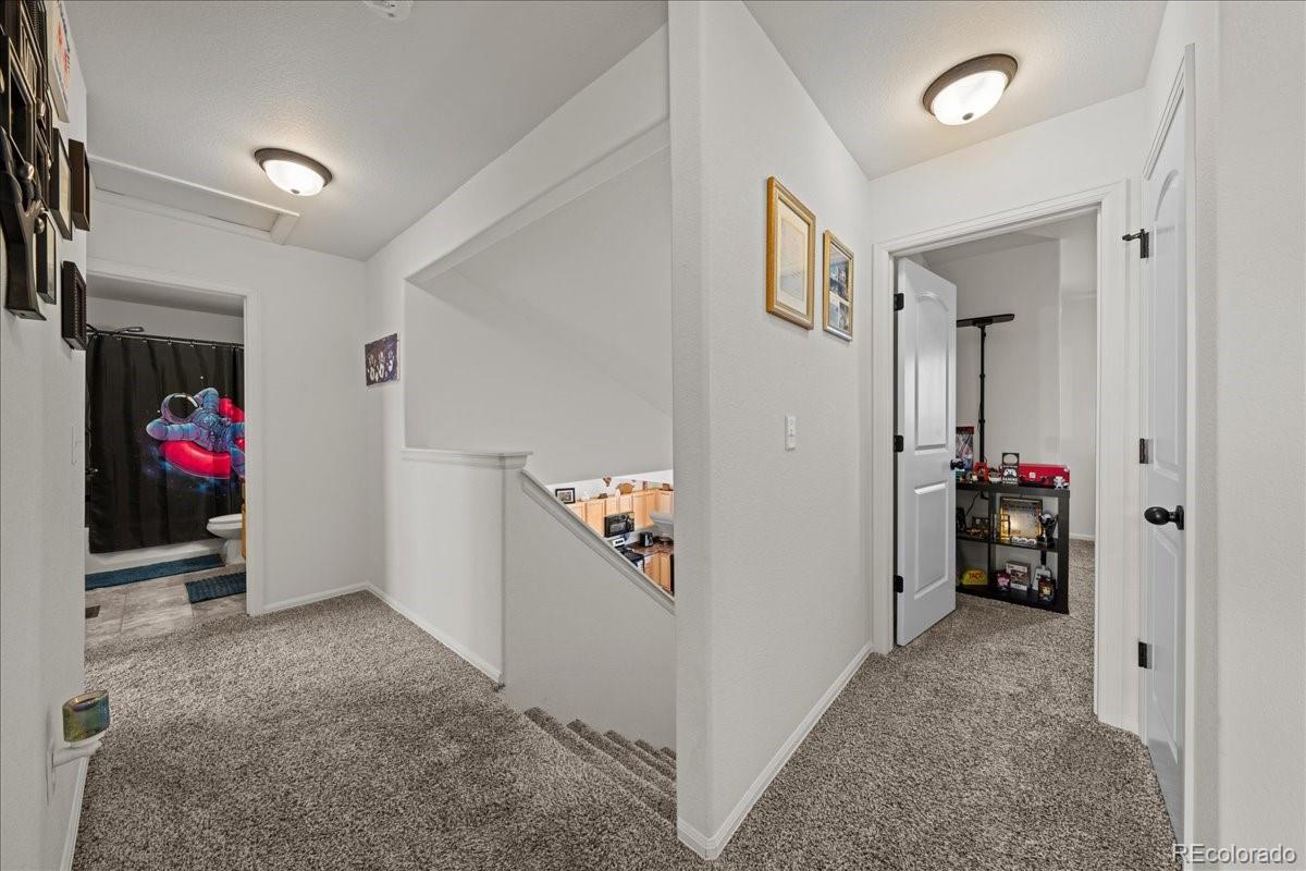 949 Ashbrook Drive Windsor, CO 80550 - Photo 24 of 33 a view of a livingroom with wooden floor and furniture