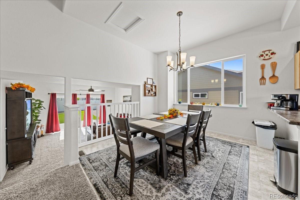 949 Ashbrook Drive Windsor, CO 80550 - Photo 9 of 33 a view of a dining room with furniture