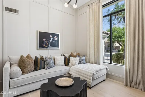 a bedroom with furniture and a window