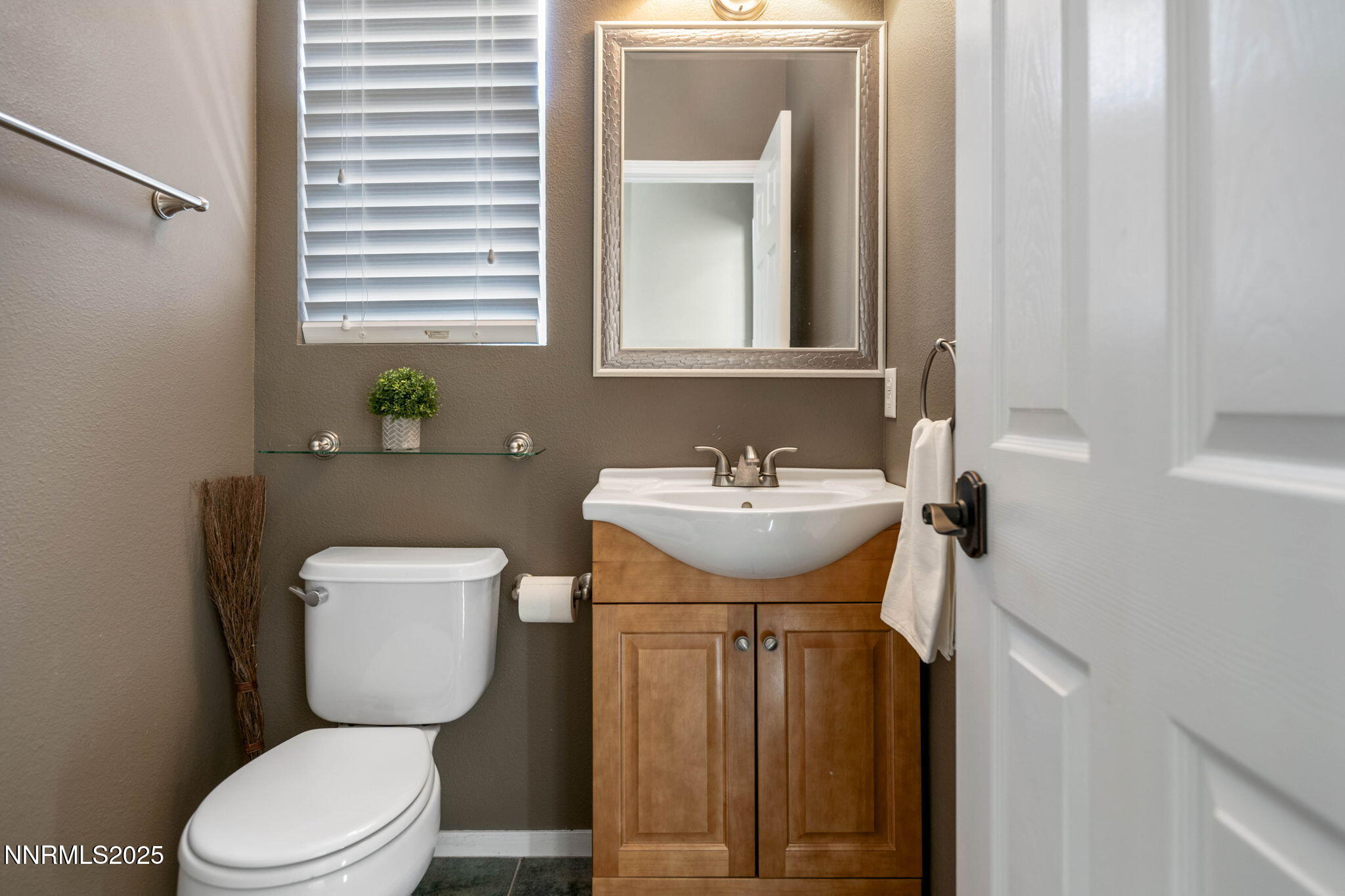 1295 Tule Drive Reno, NV 89521 - Photo 23 of 45 a bathroom with a sink toilet and mirror