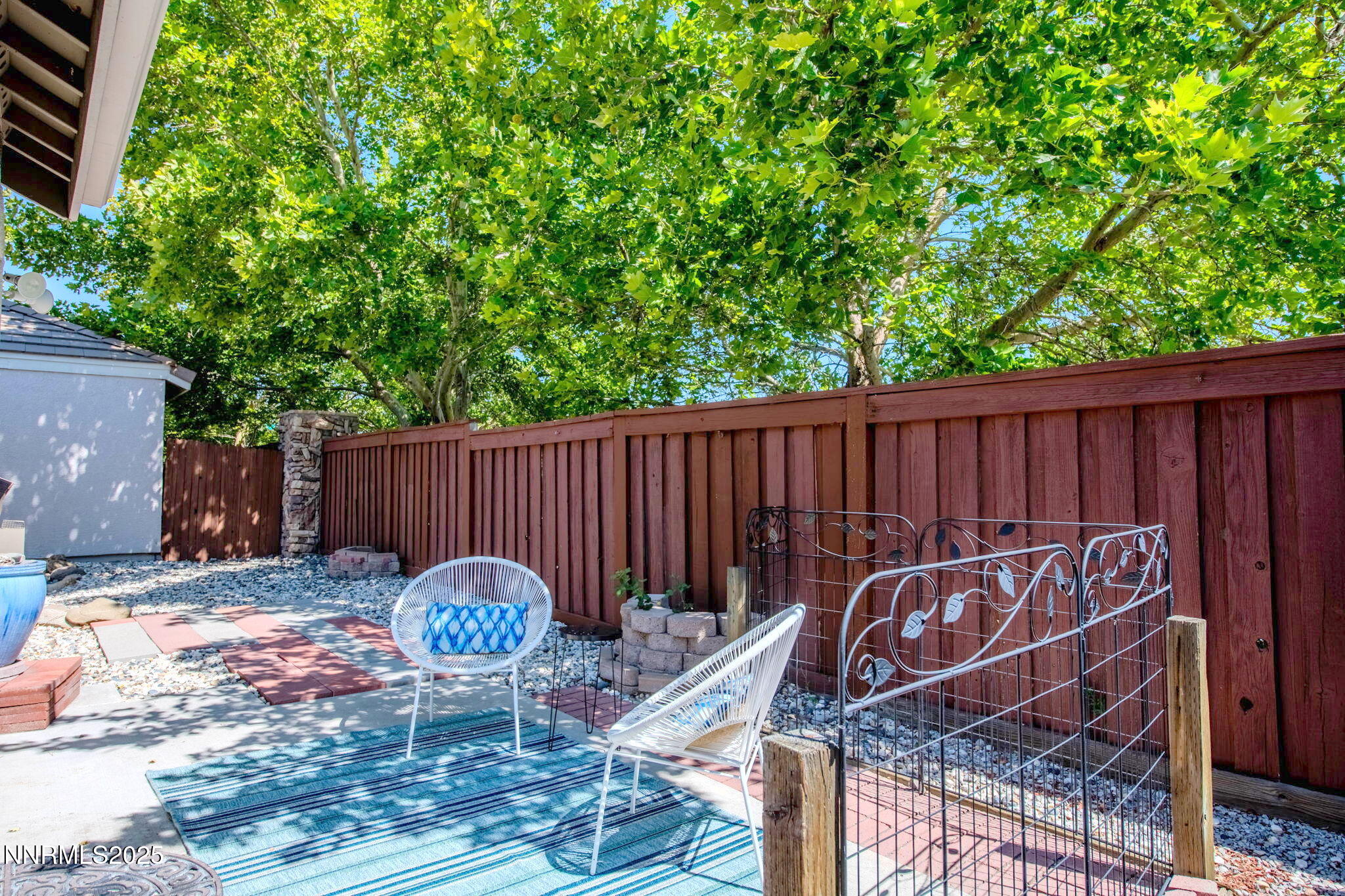 1295 Tule Drive Reno, NV 89521 - Photo 38 of 45 a view of a chairs and table in the back yard