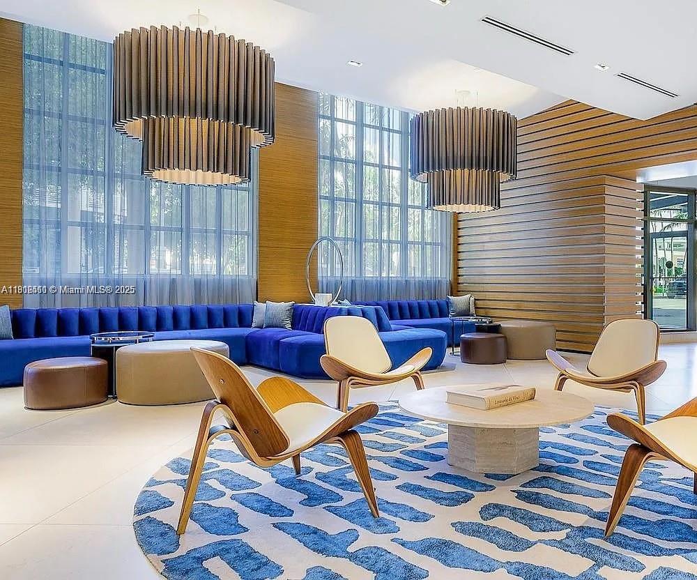 3301 Northeast 1st Avenue, Unit M0514 Miami, FL 33137 - Photo 4 of 9 a living room with furniture and a lamp