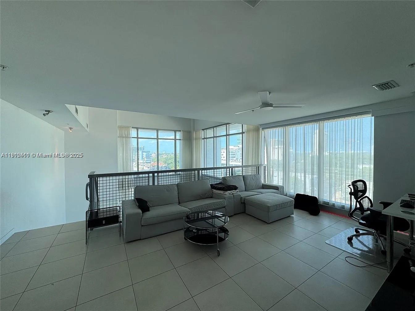 3301 Northeast 1st Avenue, Unit M0514 Miami, FL 33137 - Photo 5 of 9 a living room with furniture and a window