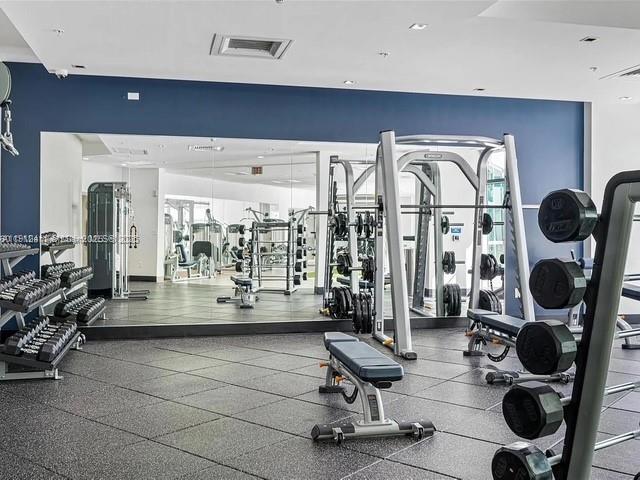 3301 Northeast 1st Avenue, Unit M0514 Miami, FL 33137 - Photo 7 of 9 a living room with furniture and floor to ceiling window