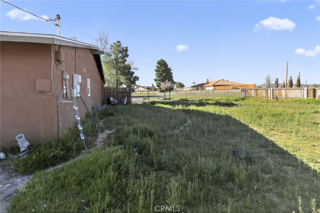 15190 Cheyenne Road Apple Valley, CA 92307 - Photo 5 of 9 a view of a back yard of the house