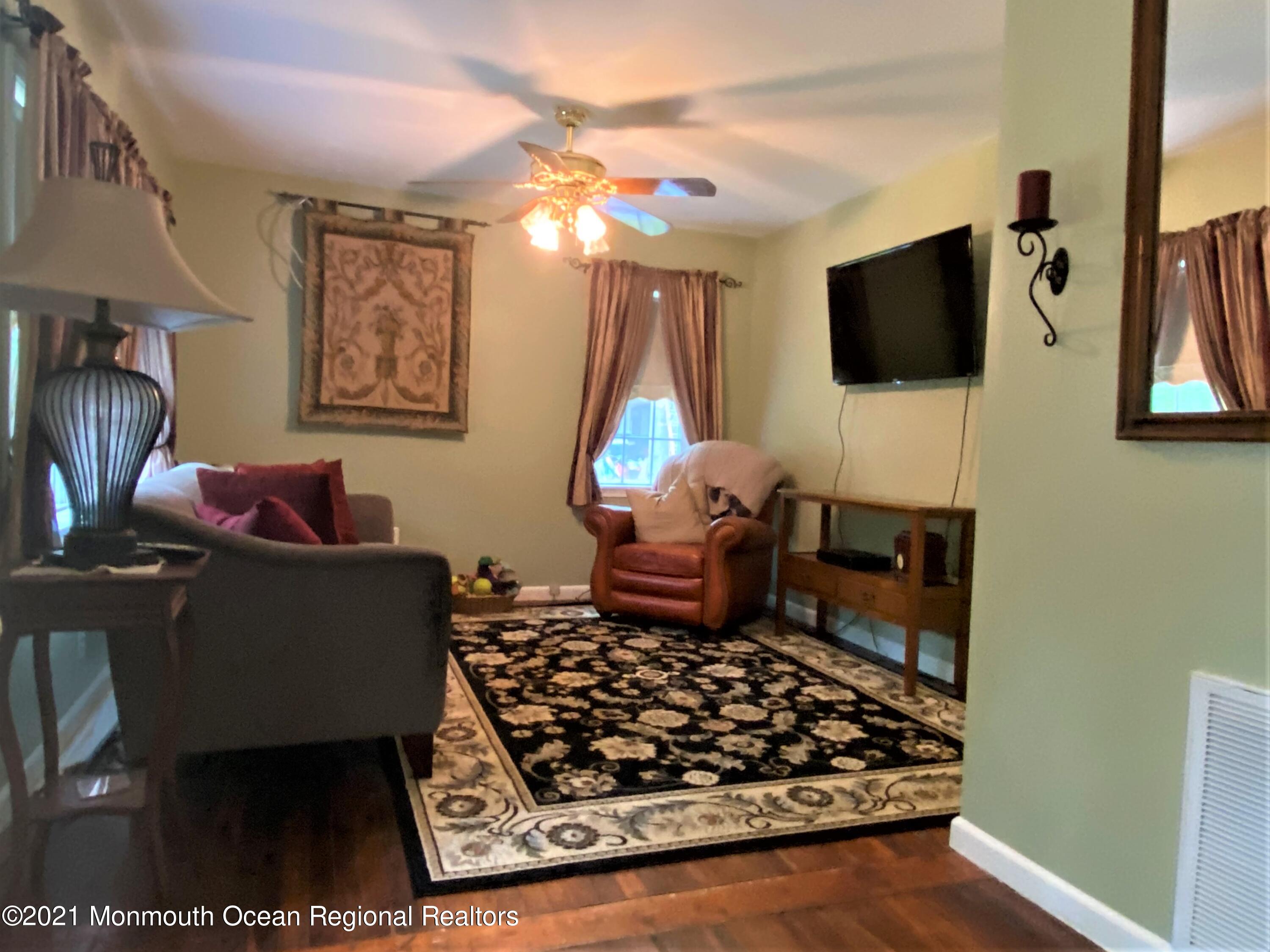 361 Black Oak Road Jackson, NJ 08527 - Photo 11 of 57 a living room with furniture and a flat screen tv