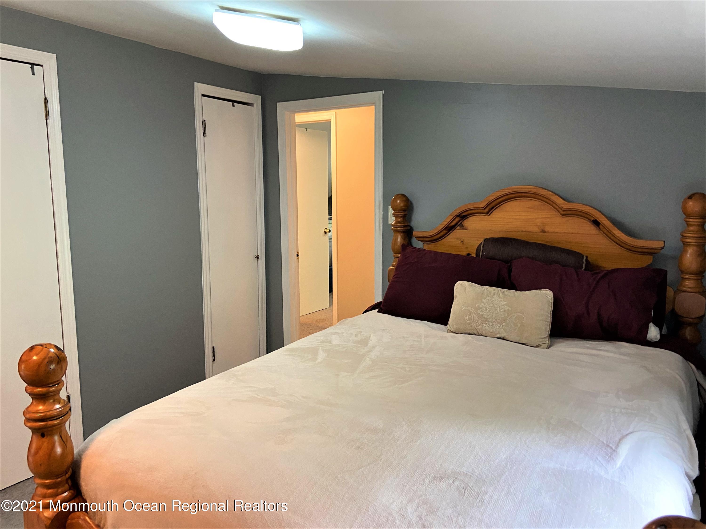361 Black Oak Road Jackson, NJ 08527 - Photo 23 of 57 a bedroom with a bed and wooden floor