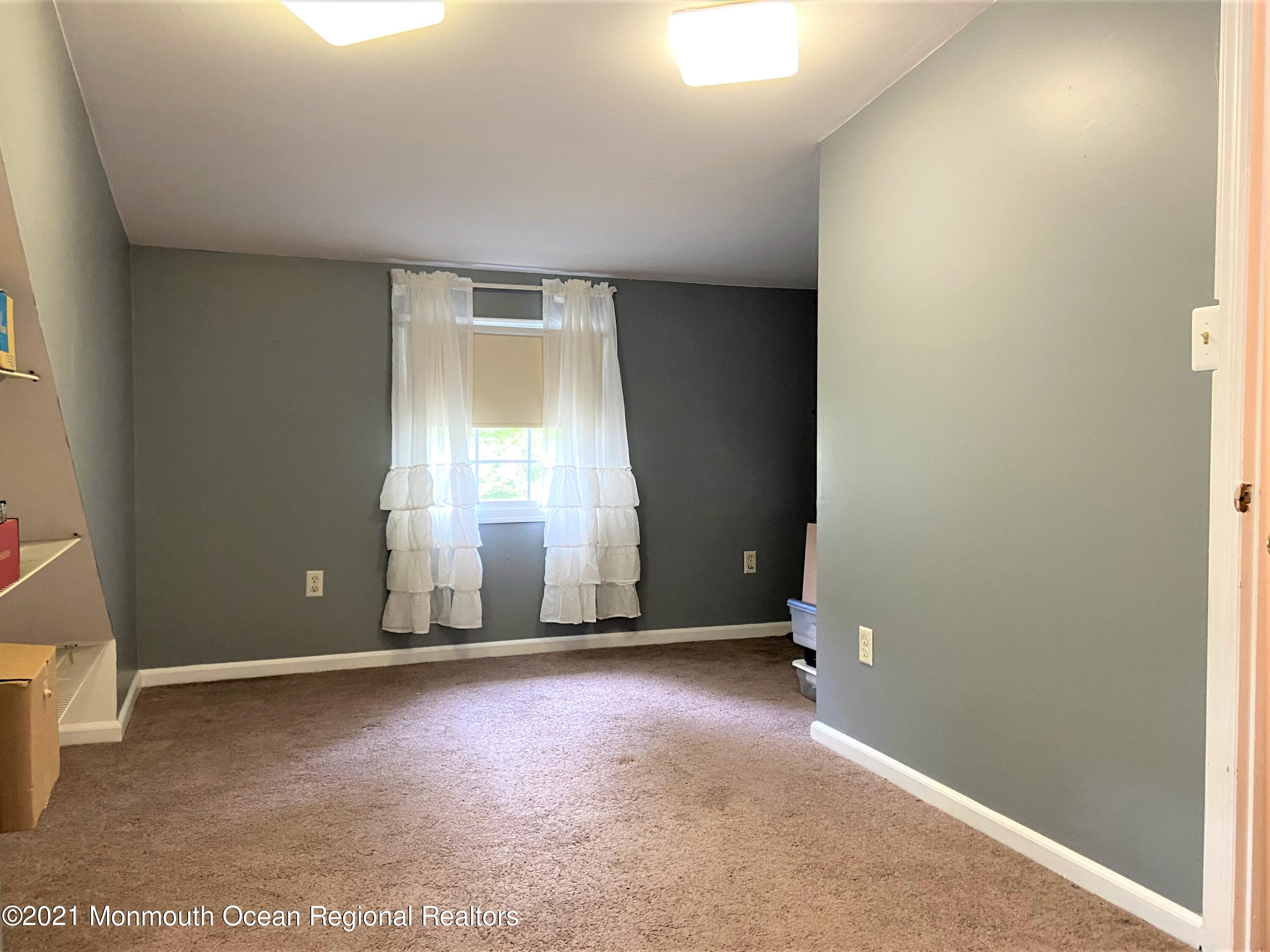 361 Black Oak Road Jackson, NJ 08527 - Photo 29 of 57 an empty room with windows