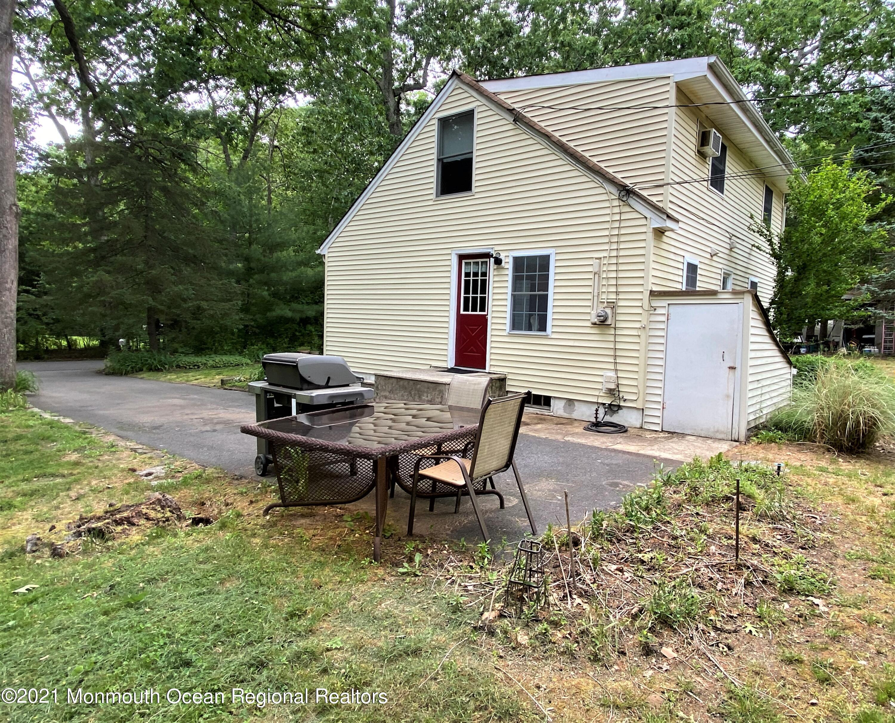 361 Black Oak Road Jackson, NJ 08527 - Photo 44 of 57 a backyard of a house with table and chairs
