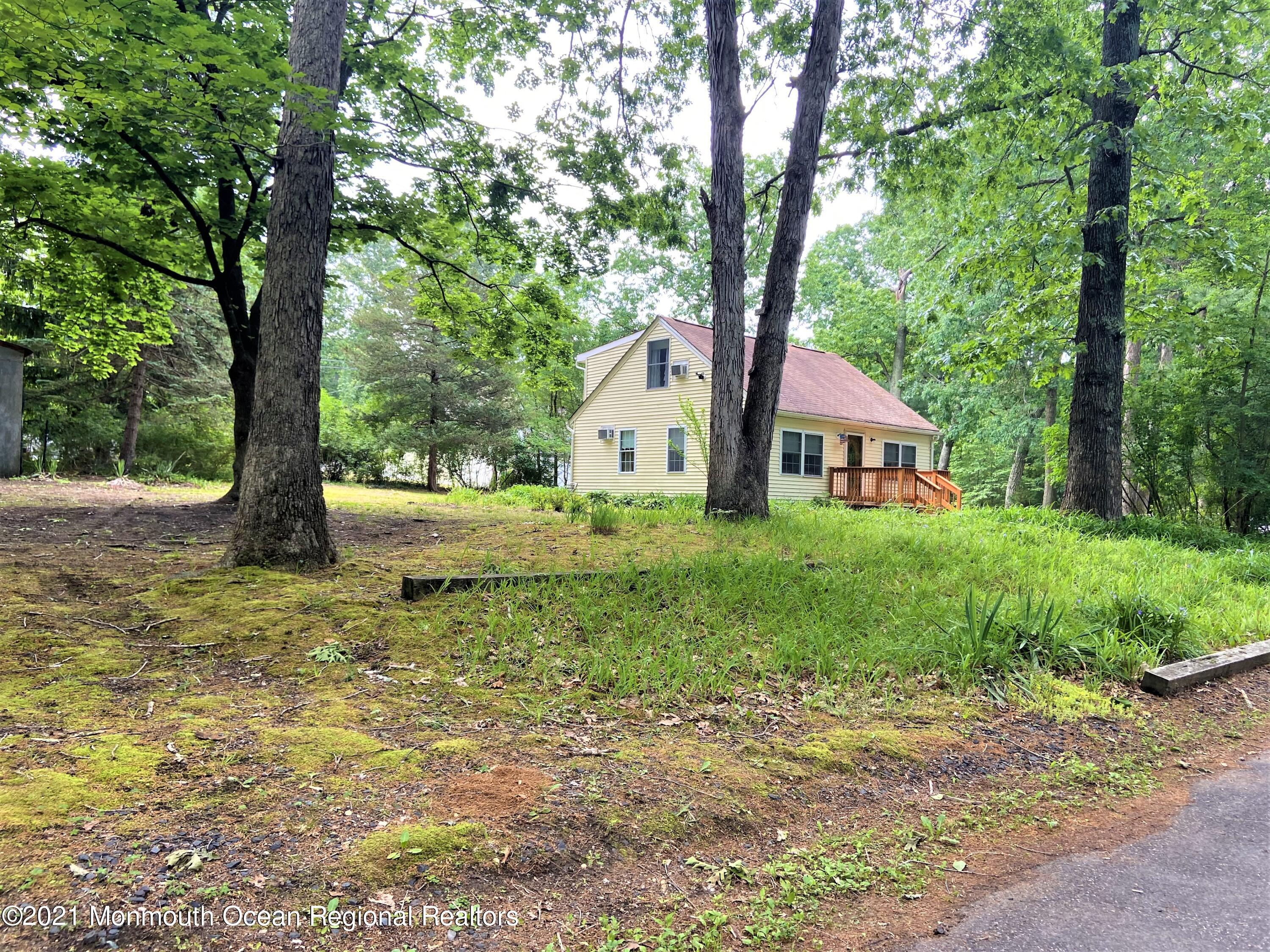 361 Black Oak Road Jackson, NJ 08527 - Photo 46 of 57 a front view of a house with garden
