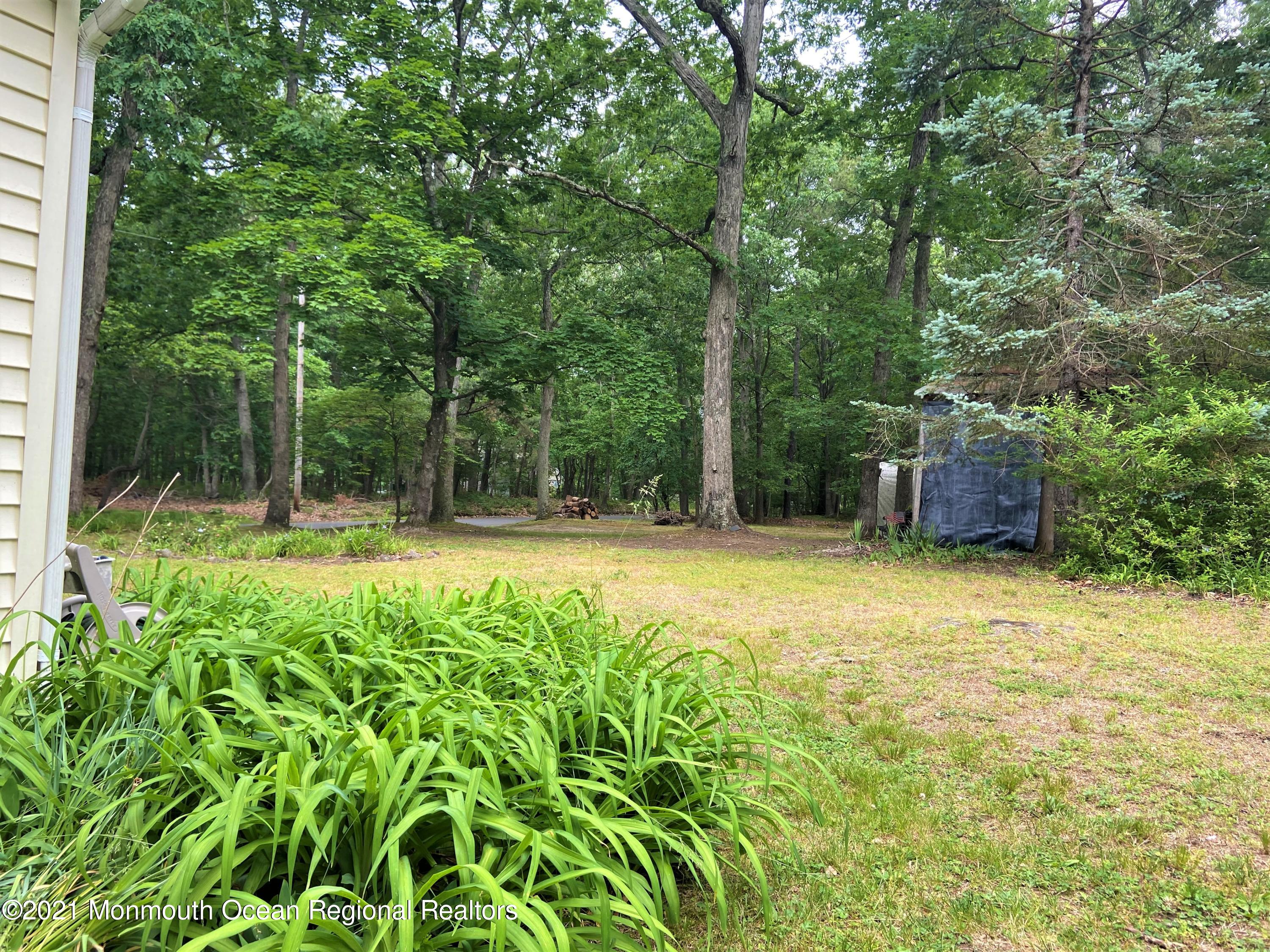 361 Black Oak Road Jackson, NJ 08527 - Photo 49 of 57 a swimming pool with outdoor seating and yard