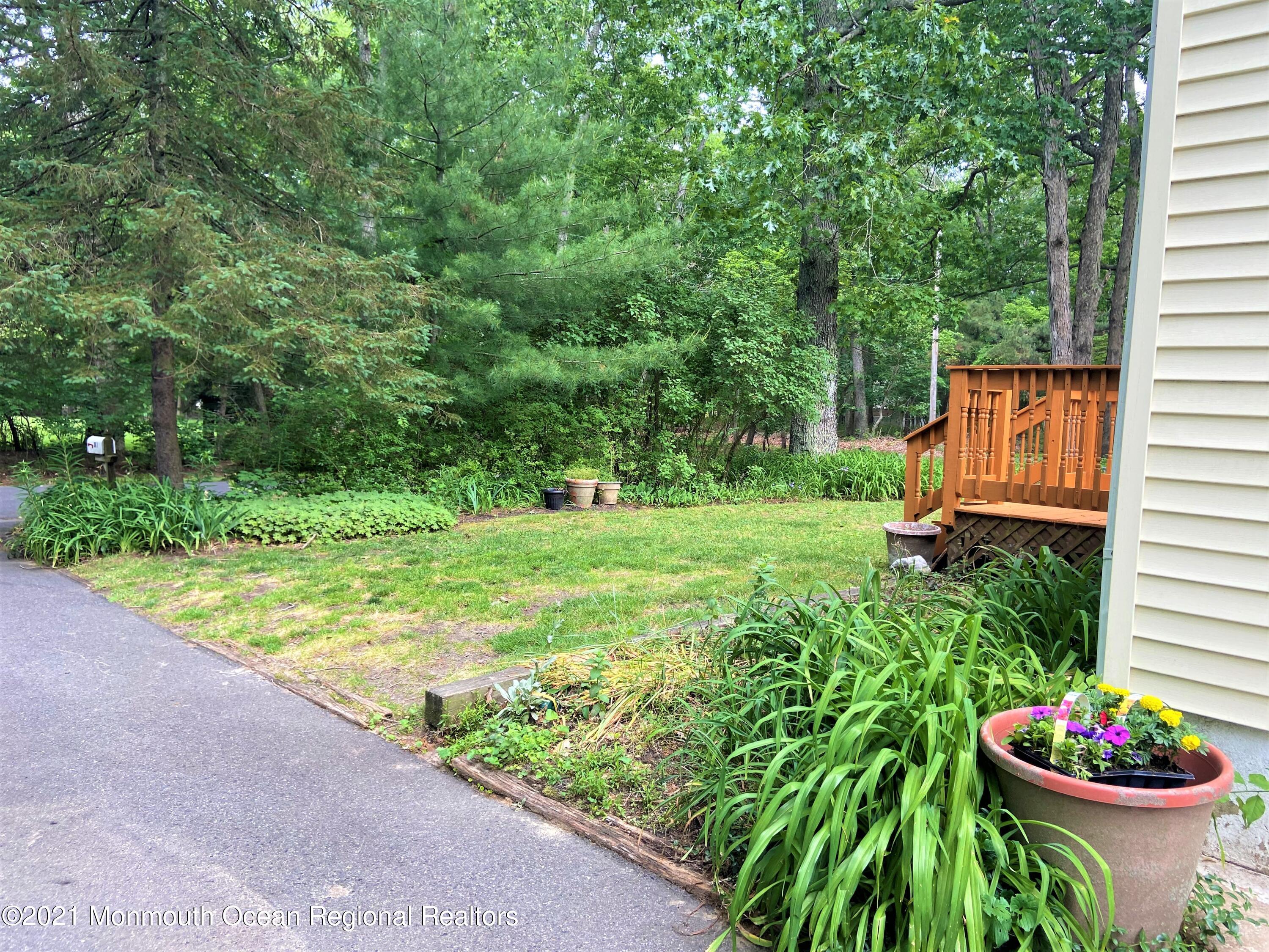 361 Black Oak Road Jackson, NJ 08527 - Photo 53 of 57 a view of a garden with a patio