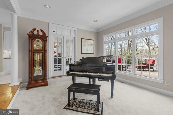 a living room with furniture and a chair