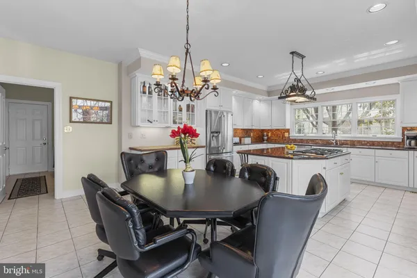 a view of a patio with table and chairs and wooden floor