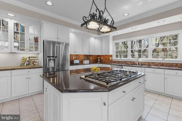 a living room with furniture and stairs