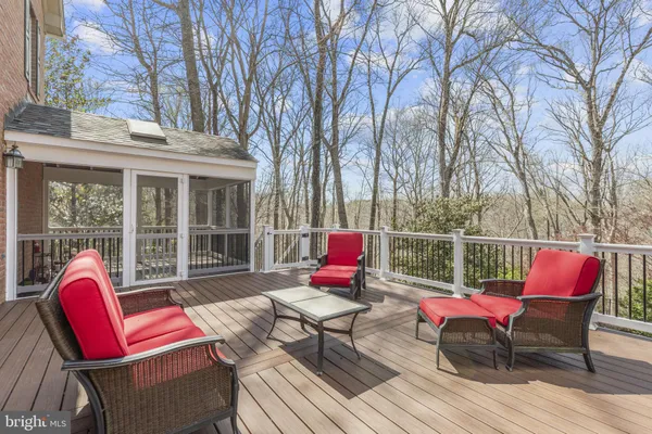 a spacious bedroom with a bed and a ceiling fan