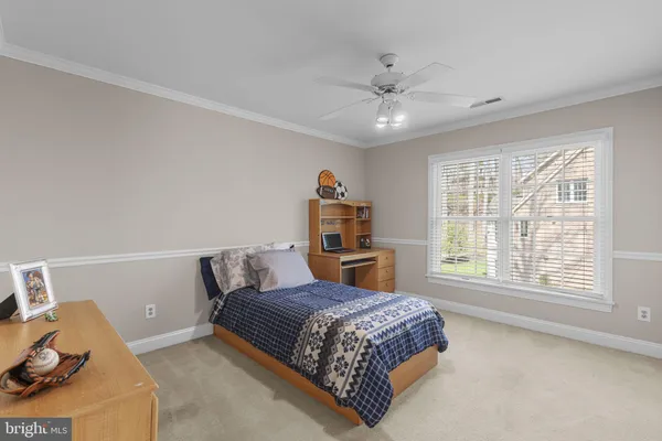 a front view of a house with a yard table and chairs