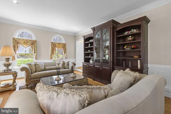 a living room with furniture or couch and a large window