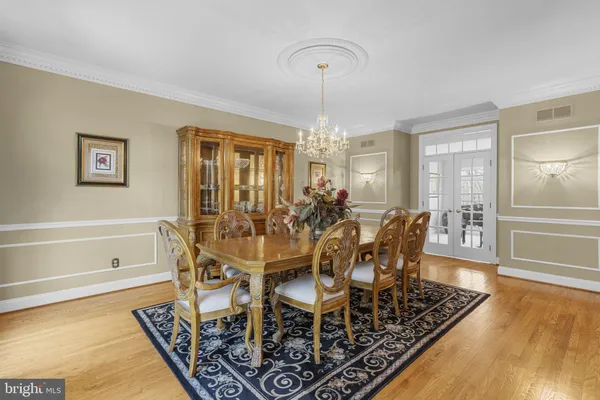 a living room with furniture a large window and a fireplace
