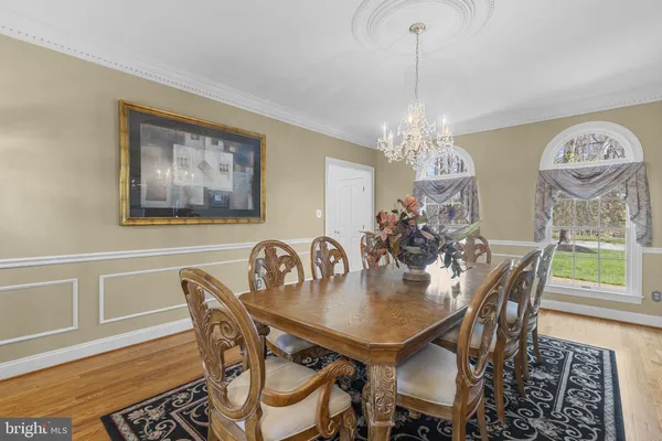 a living room with fireplace furniture and a wooden floor