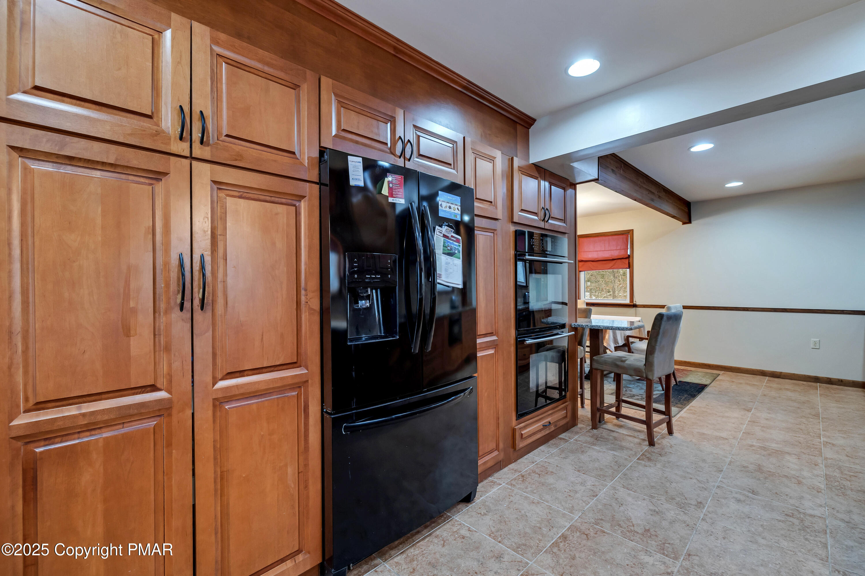 345 Canterbury Road Bushkill, PA 18324 - Photo 12 of 57 a kitchen with stainless steel appliances granite countertop a refrigerator and a sink
