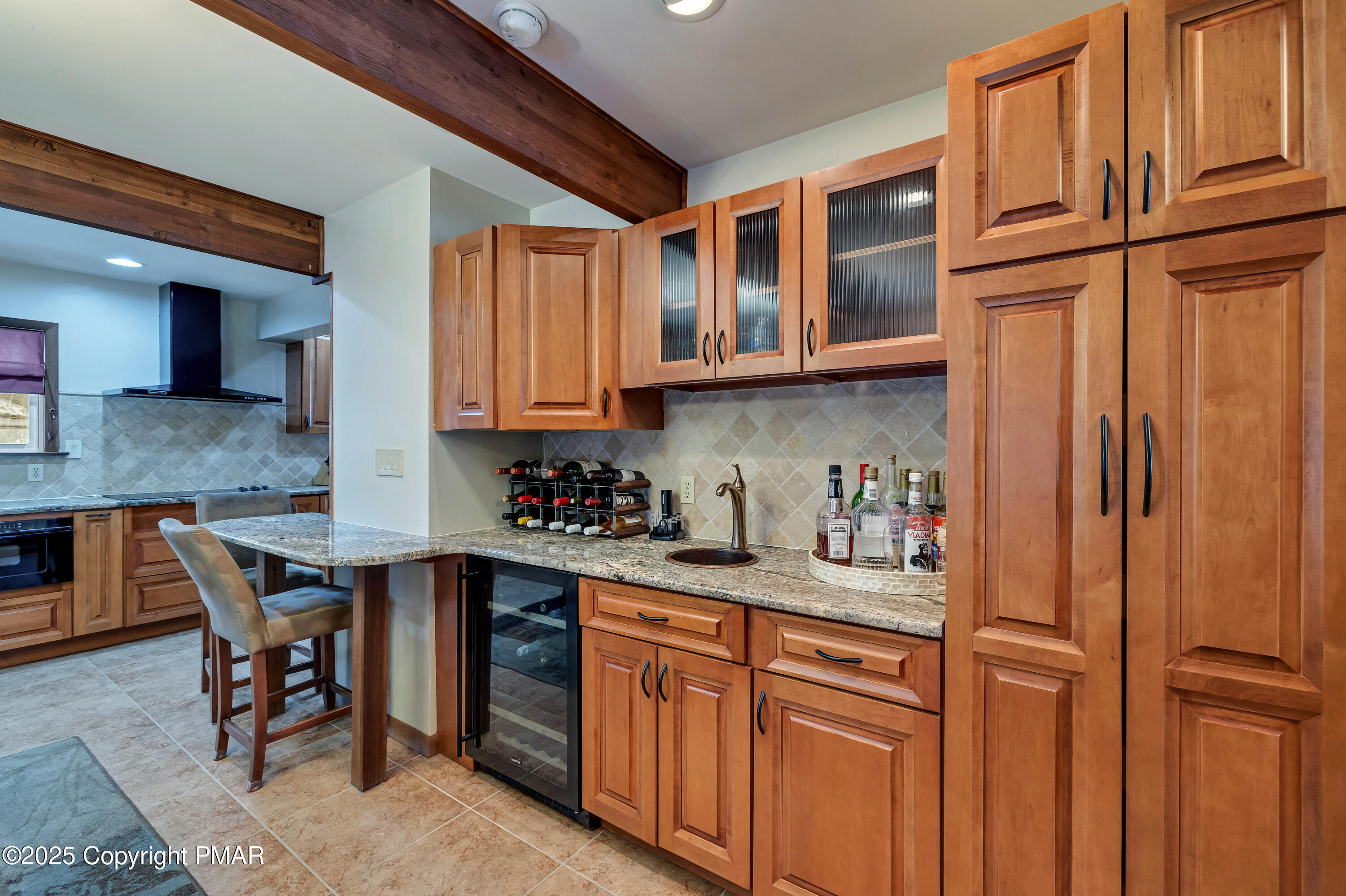 345 Canterbury Road Bushkill, PA 18324 - Photo 14 of 57 a kitchen with stainless steel appliances granite countertop a sink and cabinets