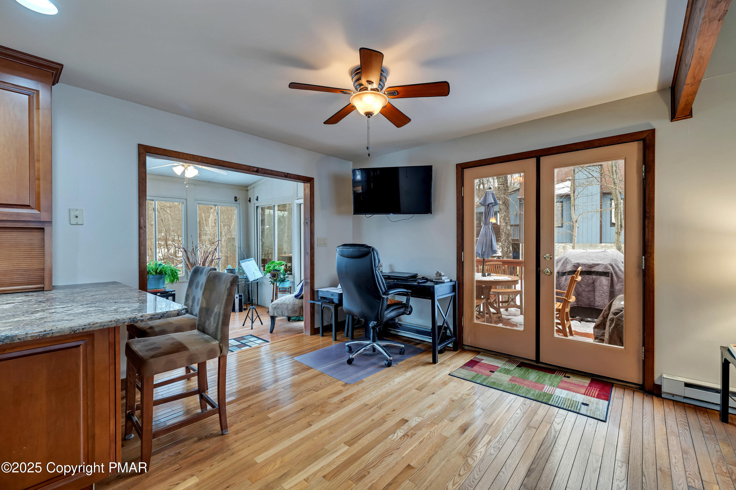 345 Canterbury Road Bushkill, PA 18324 - Photo 17 of 57 a living room with furniture a fireplace and a flat screen tv