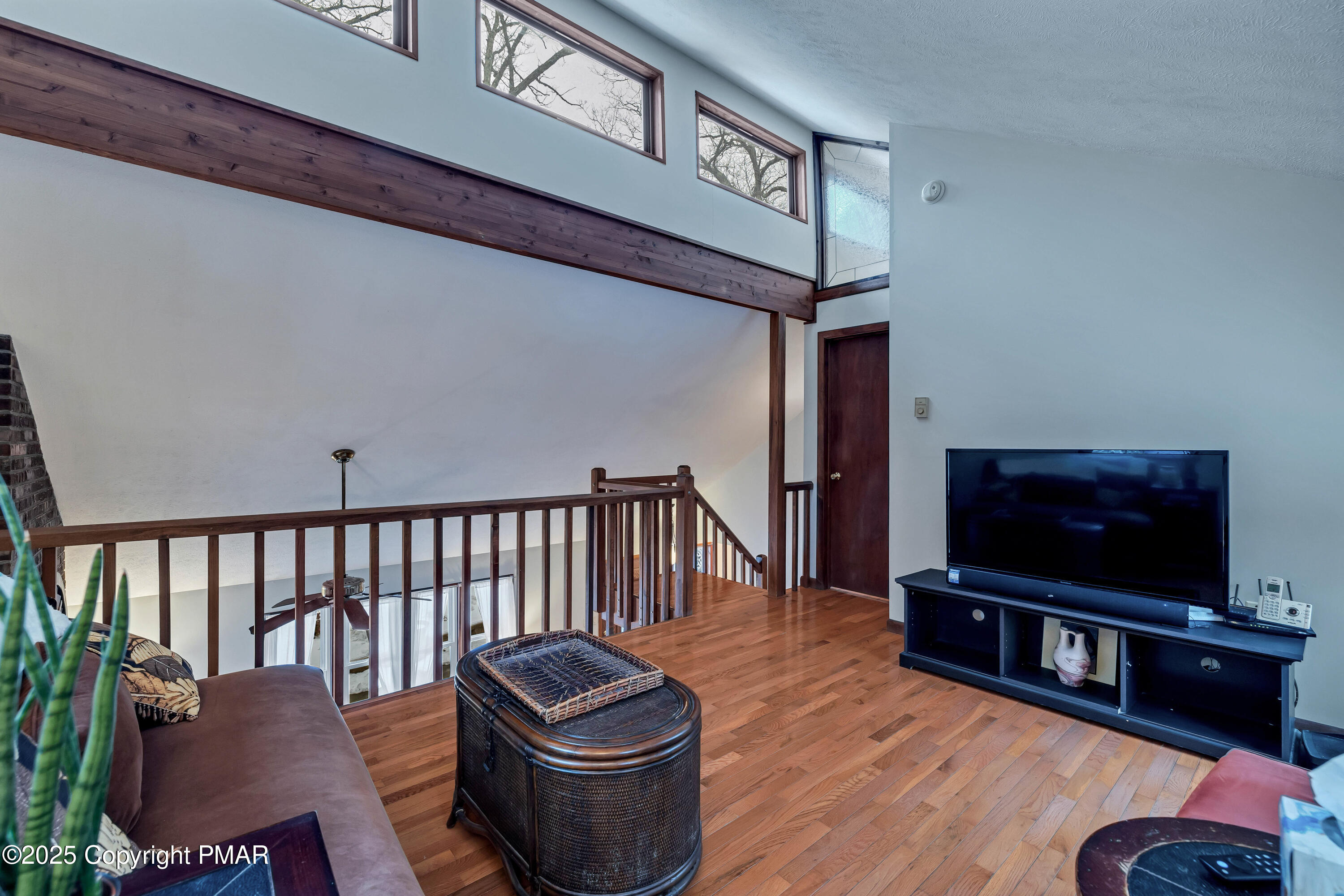 345 Canterbury Road Bushkill, PA 18324 - Photo 21 of 57 a living room with furniture and a flat screen tv