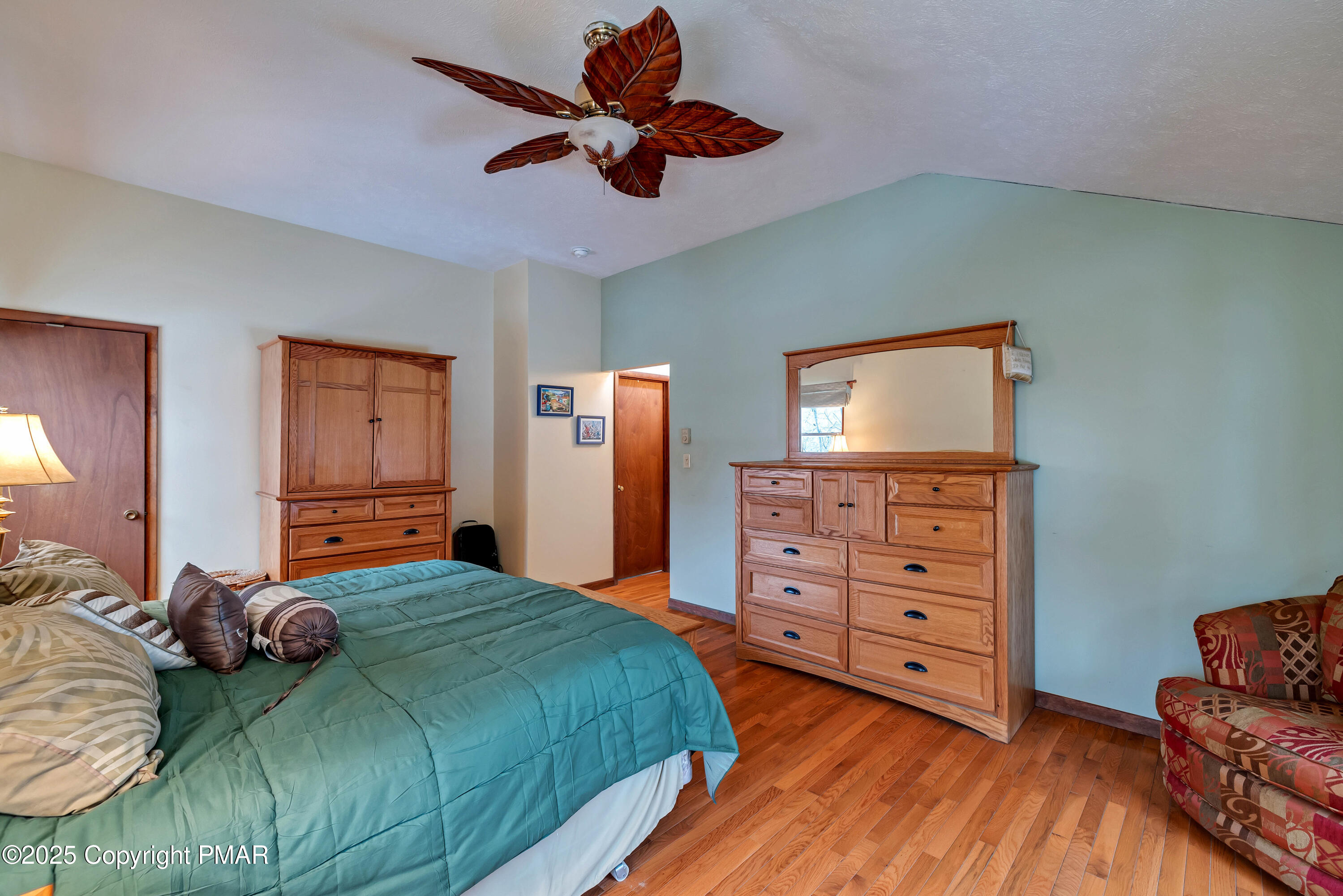 345 Canterbury Road Bushkill, PA 18324 - Photo 23 of 57 a bedroom with a bed and a dresser