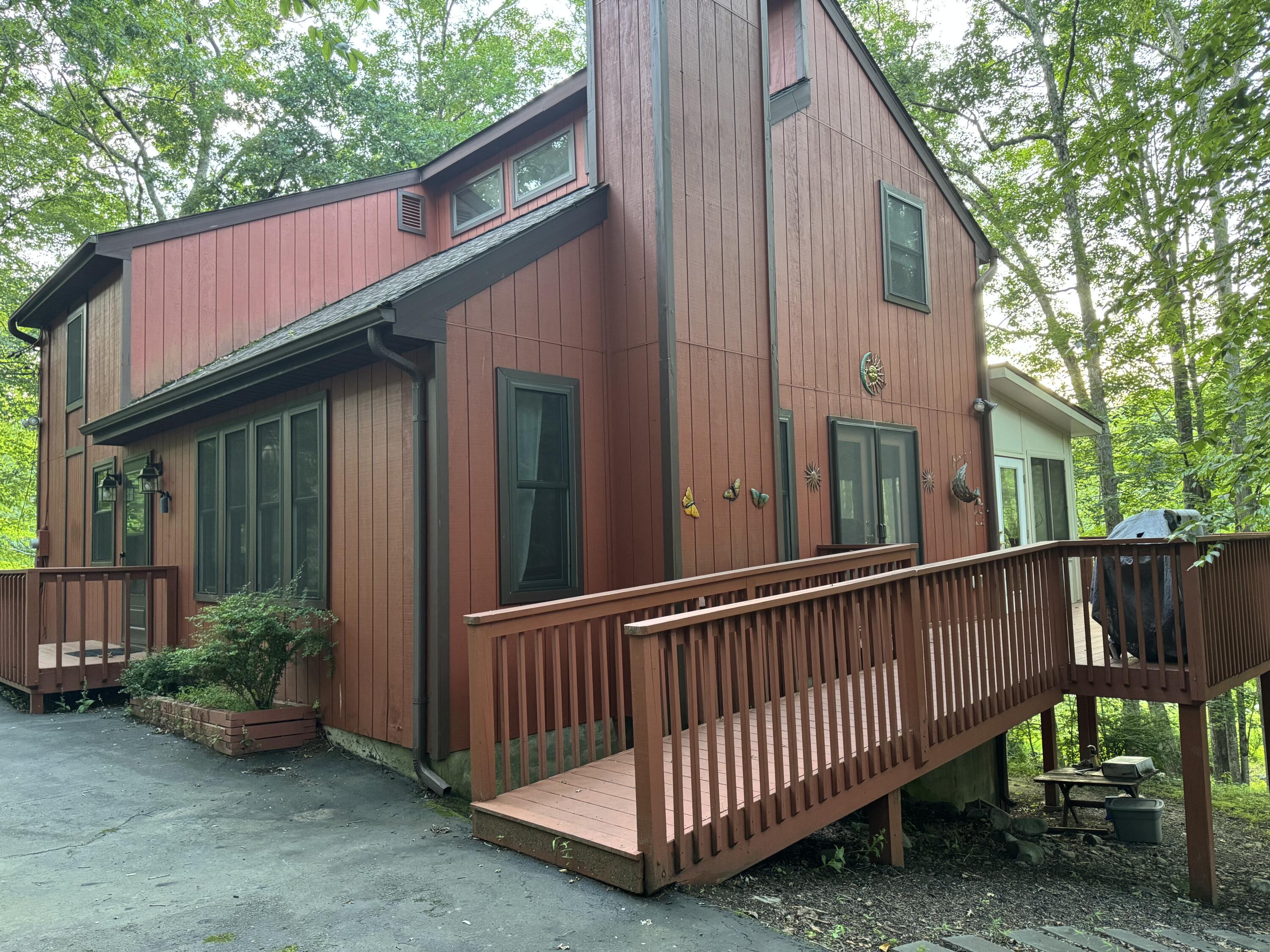 345 Canterbury Road Bushkill, PA 18324 - Photo 3 of 57 a view of a house with backyard and porch