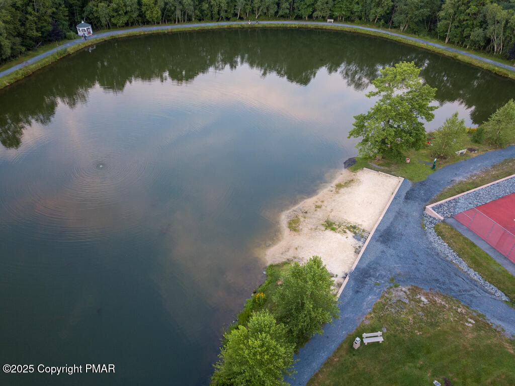 345 Canterbury Road Bushkill, PA 18324 - Photo 44 of 57 an aerial view of a house a yard and a garden