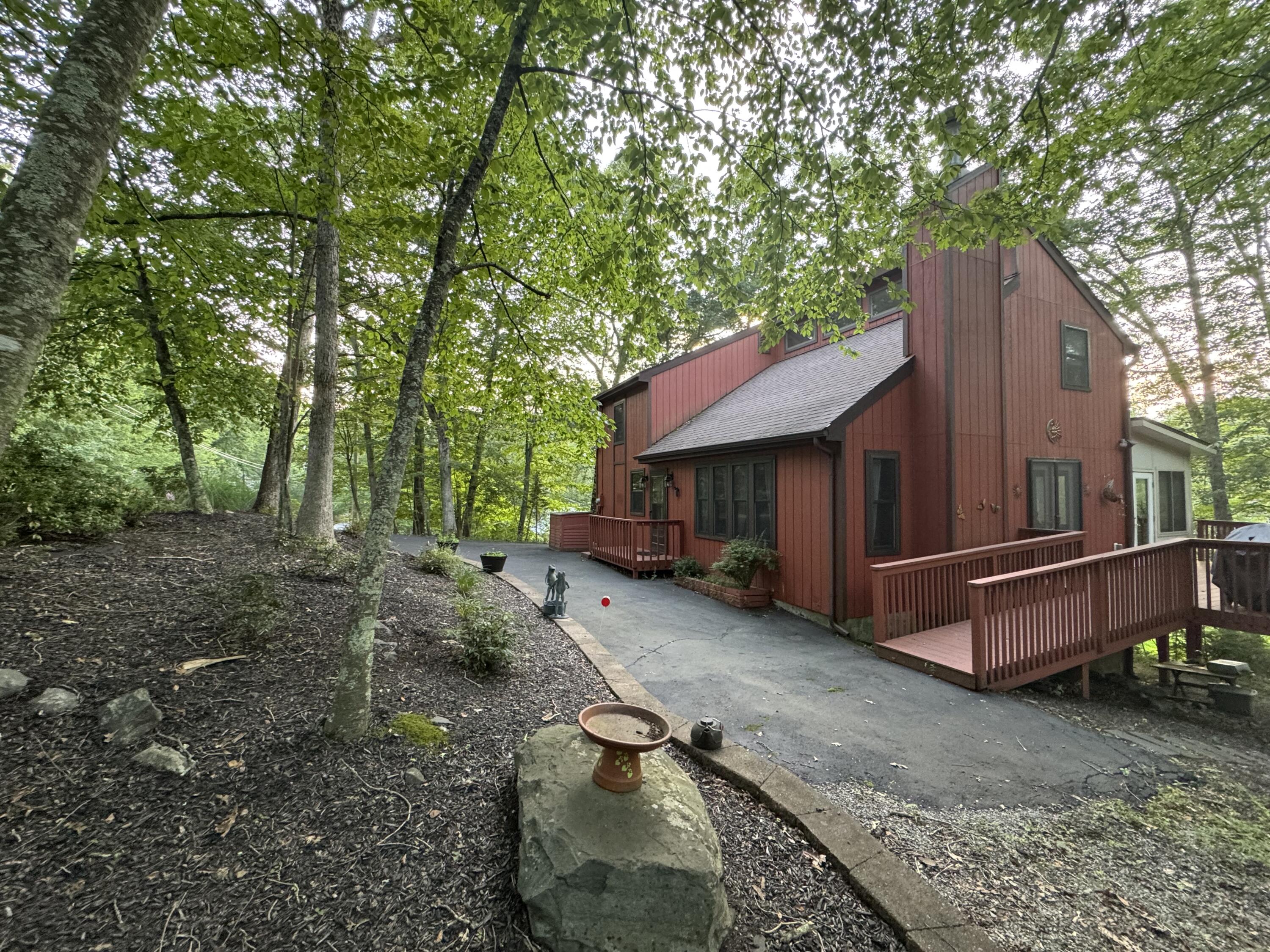 345 Canterbury Road Bushkill, PA 18324 - Photo 46 of 57 a view of a house with a yard