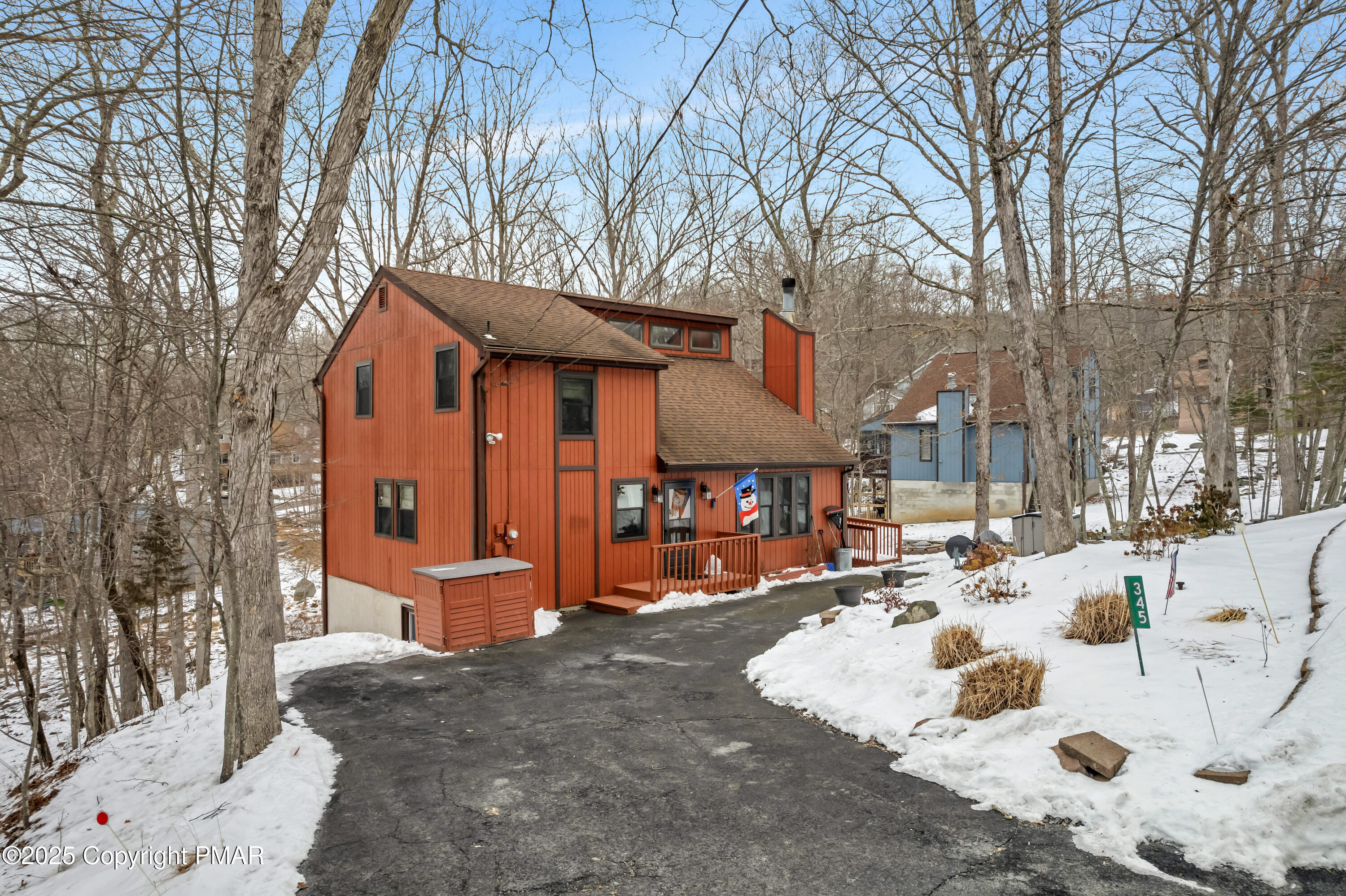 345 Canterbury Road Bushkill, PA 18324 - Photo 49 of 57 a view of a house with a snow on the road