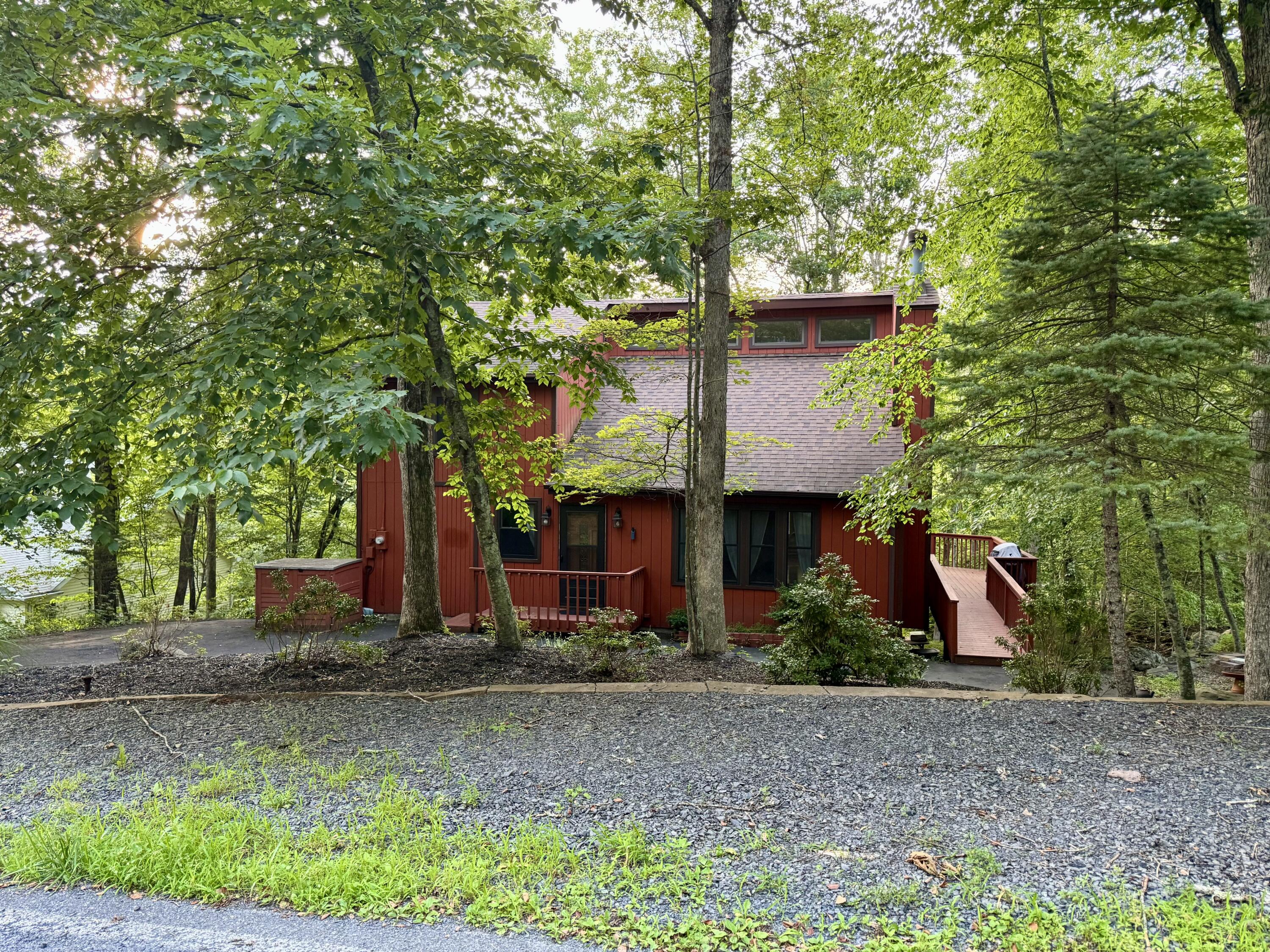 345 Canterbury Road Bushkill, PA 18324 - Photo 5 of 57 a front view of house with small garden