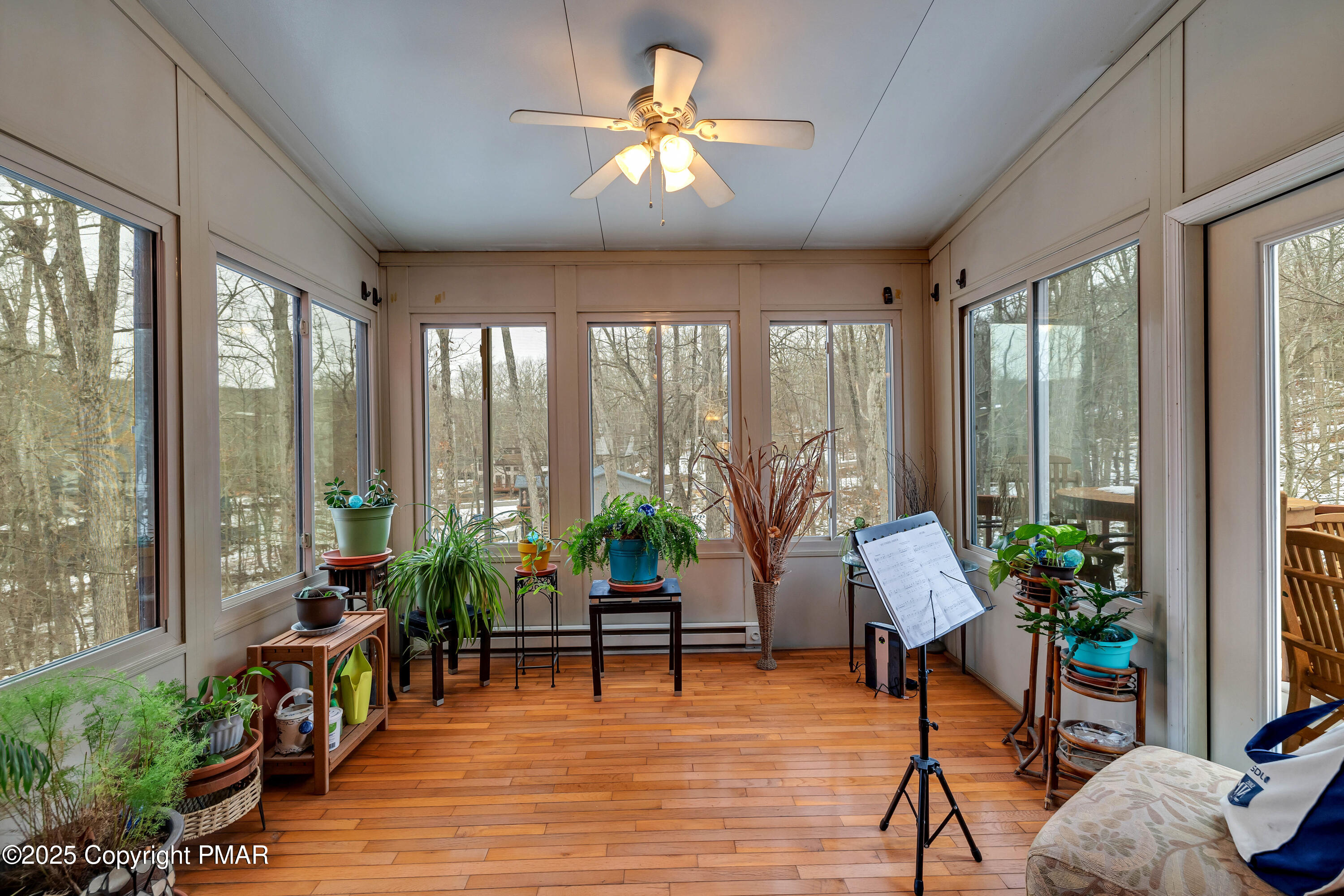 345 Canterbury Road Bushkill, PA 18324 - Photo 9 of 57 a living room with furniture and a large window