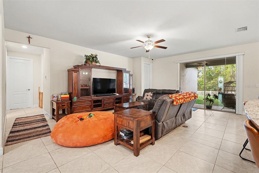12593 Palapa Loop Spring Hill, FL 34610 - Photo 5 of 21 a living room with furniture and a flat screen tv
