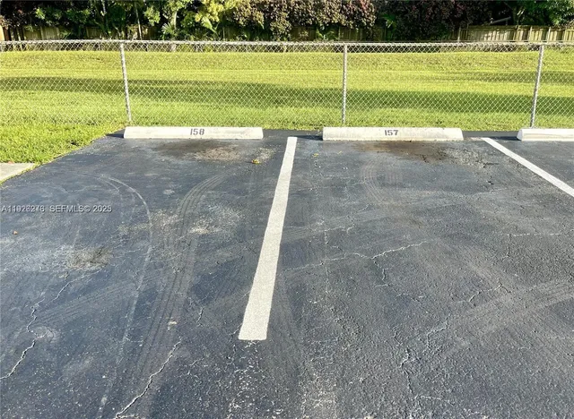 a view of a swimming pool with a yard