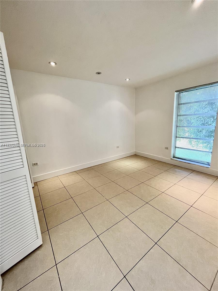 7250 Southwest 94th Place, Unit B6 Miami, FL 33173 - Photo 7 of 23 a view of an empty room and staircase