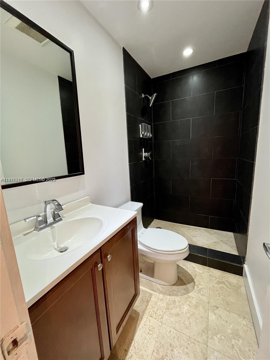 7250 Southwest 94th Place, Unit B6 Miami, FL 33173 - Photo 8 of 23 a bathroom with a sink and a mirror