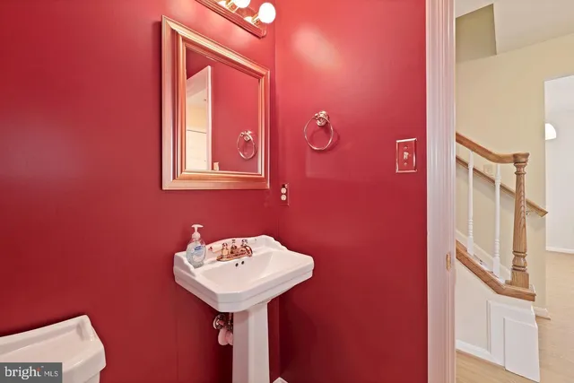 a bathroom with a sink and mirror