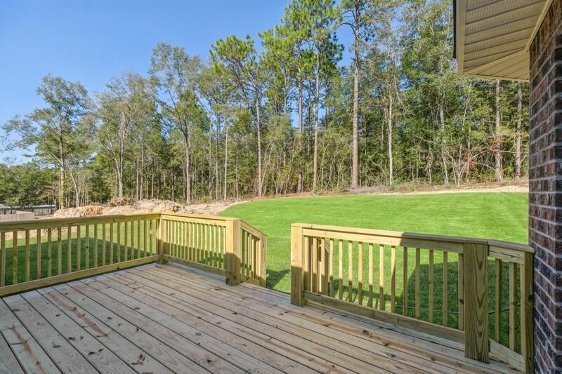 3933 Poverty Creek Road Crestview, FL 32539 - Photo 31 of 32 a view of a wooden deck with a yard