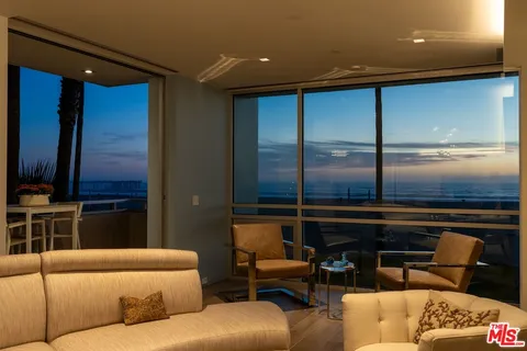 a projector room with a couch and a fireplace