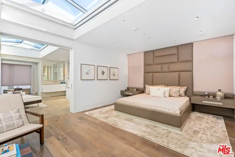 a bedroom with a bed and a table